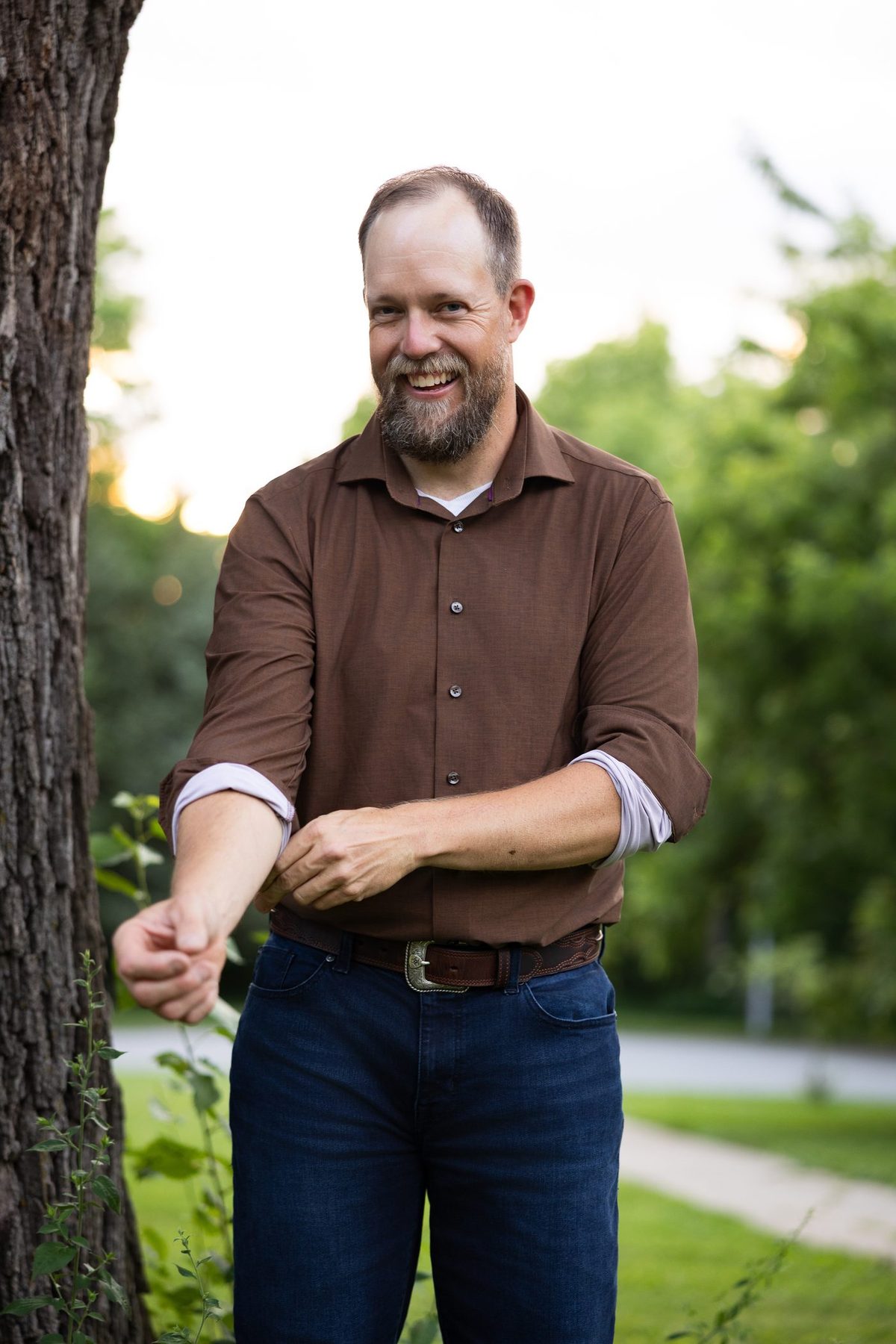Aaron Thiessen inspecting a tree for plant health care in Omaha