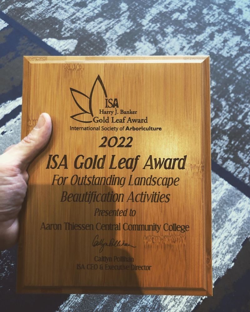 2022 ISA Harry J. Banker Gold Leaf Award presented to Aaron Thiessen and Central Community College for outstanding landscape beautification activities